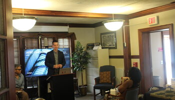 Emcee- Professor John Meyers speaking to attendees