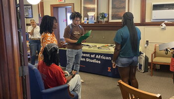 Students and faculty member talking