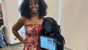 Professor Ruby Mendenhall with another robot