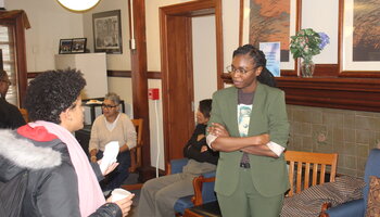 Student talking to faculty member