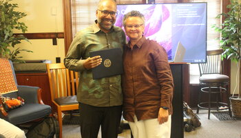 Certificate presented by Professor Merle Bowen to Professor Erik McDuffie