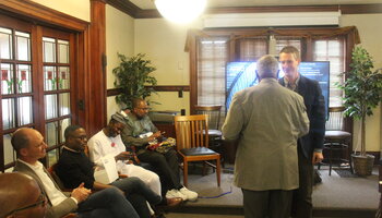 Professor Ronald Bailey accepting his award certificate from Professor John Meyers