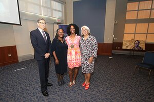 From left: Gene Robinson, director of the Carl R. Woese Institute for Genomic Biology and Swanlund Chair in Entomology, Venetria K. Patton, Harry E. Preble Dean of the College of LAS, Ruby Mendenhall, and Rosa Milagros Santos, associate provost for faculty development, attend the ceremony honoring Mendenhall as the Kathryn Lee Baynes Dallenbach Professor in Liberal Arts & Sciences.