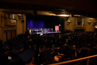 Distance shot of all presenters for convocation on stage 