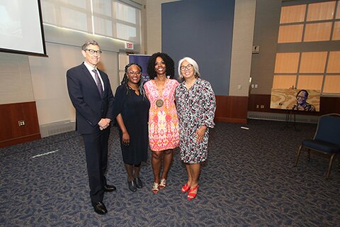 From left: Gene Robinson, director of the Carl R. Woese Institute for Genomic Biology and Swanlund Chair in Entomology, Venetria K. Patton, Harry E. Preble Dean of the College of LAS, Ruby Mendenhall, and Rosa Milagros Santos, associate provost for faculty development, attend the ceremony honoring Mendenhall as the Kathryn Lee Baynes Dallenbach Professor in Liberal Arts & Sciences.