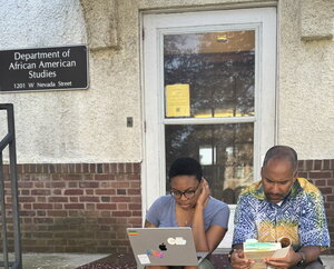 Professor Erik McDuffie and Camryn Burkins (MA/MS student in History and Information) discussing African history on the front steps of African American Studies