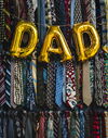 Dad balloon hanging from ties