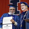 Dr. Lonnie Bunch III receives his honorary degree from President Timothy Killeen