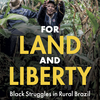 for land and liberty book cover. loarge yellow title letters and a man smiling and reaching up surrounded by forest